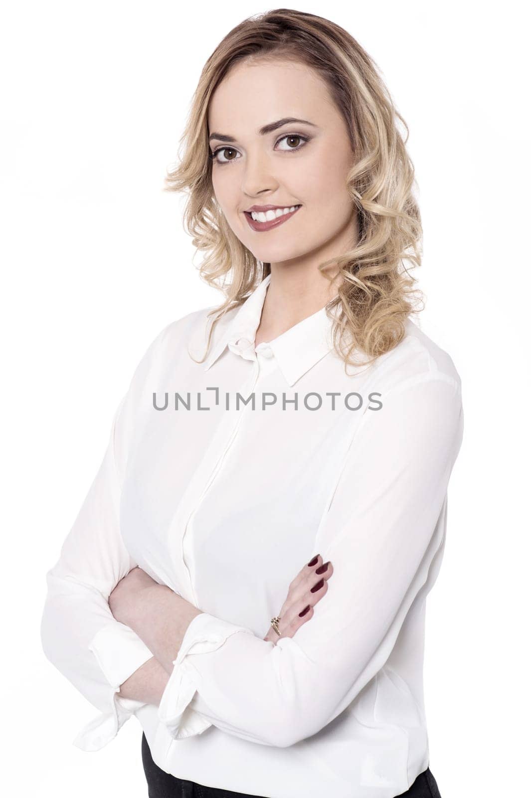 Side shot of young woman arms crossed