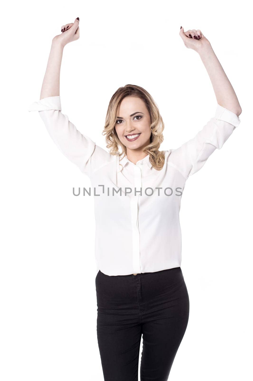 Pretty woman posing arms raised