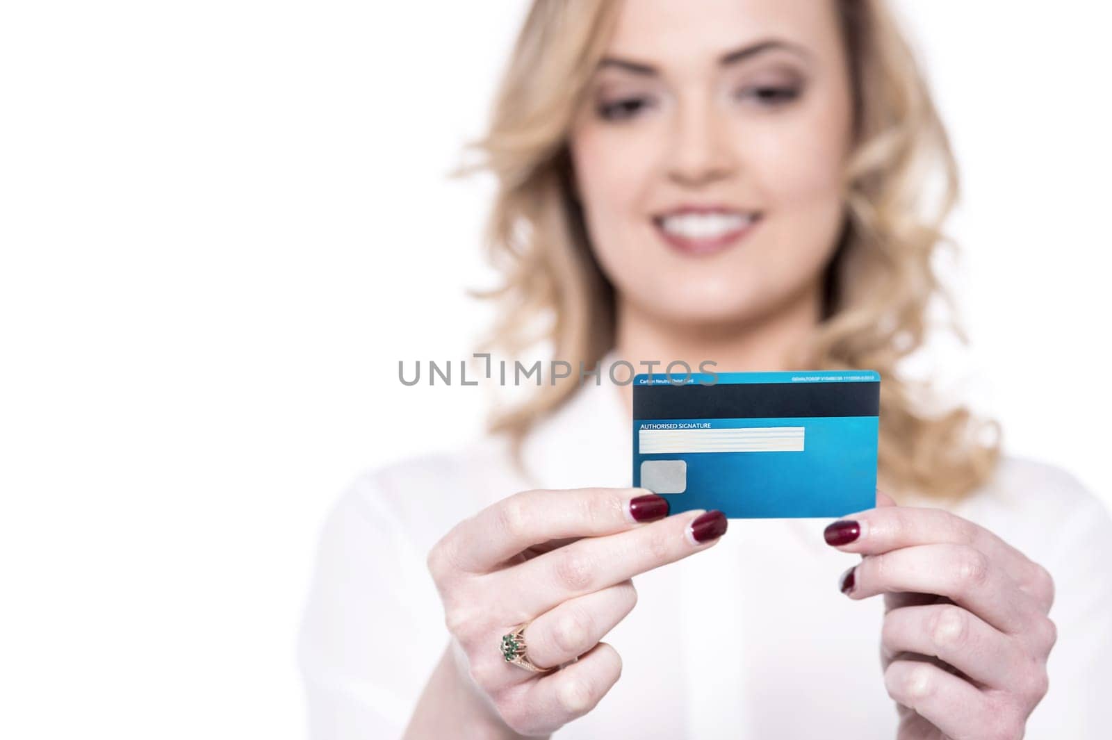 Smiling woman reading her credit card