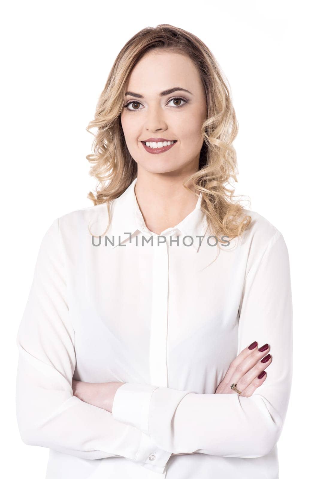 Young smiling lady posing arms crossed