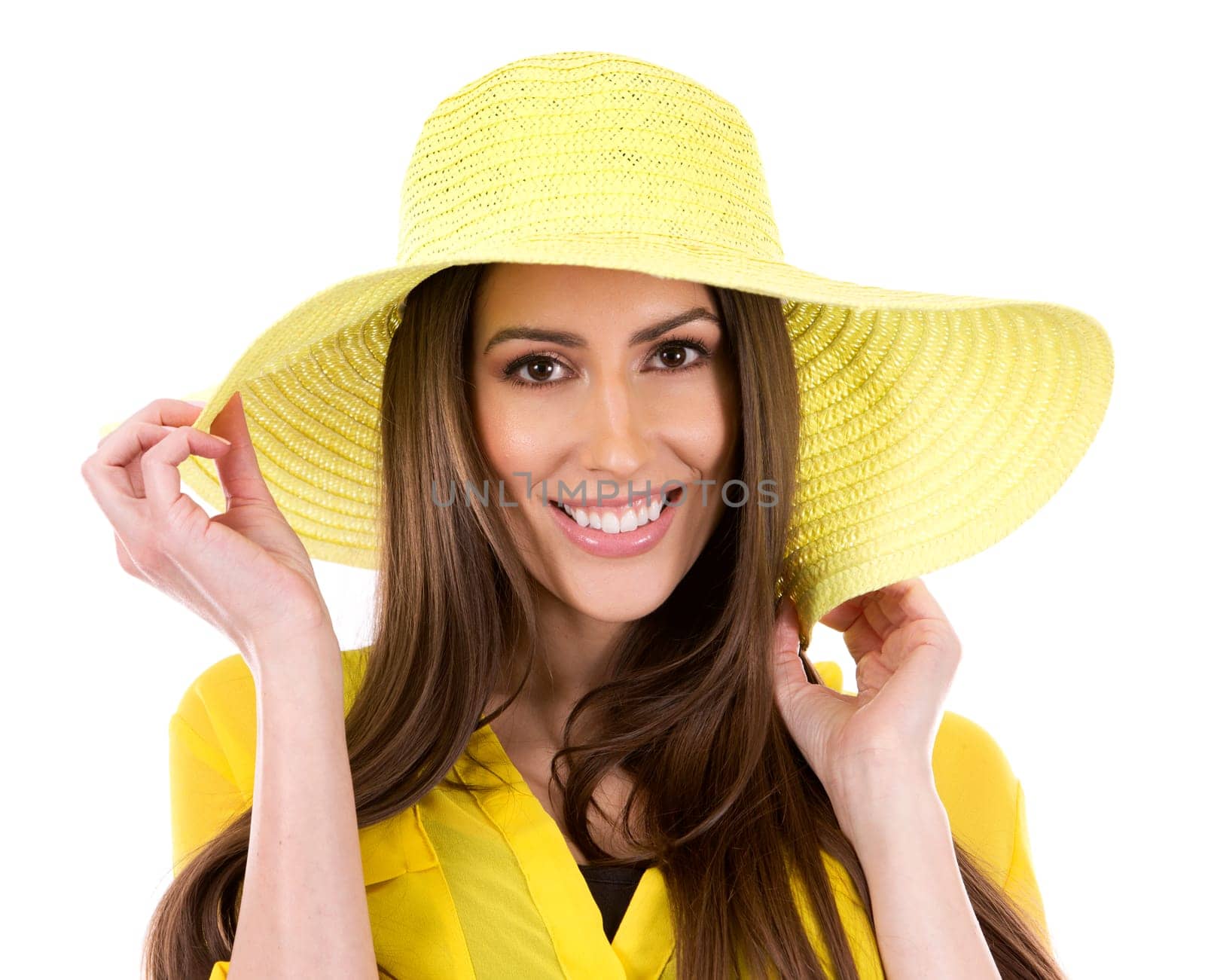 young woman wearing yellow shirt and hat on white background