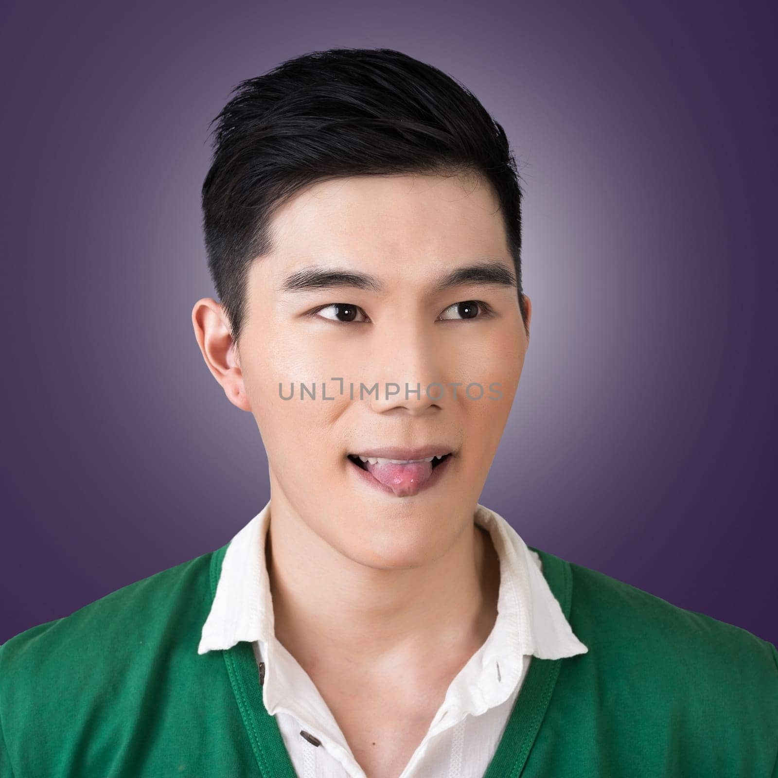 Funny facial expression, closeup Asian young man.