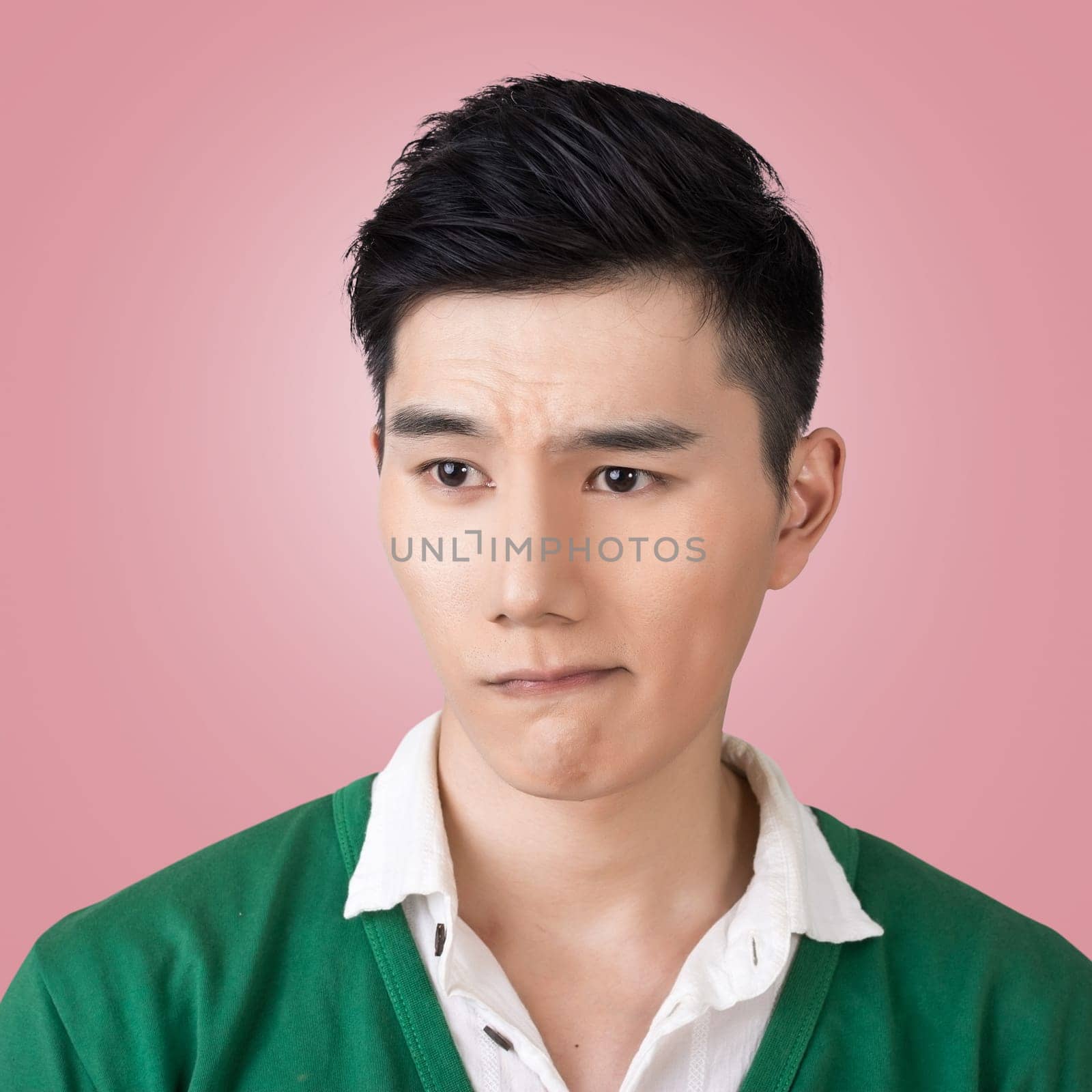 Funny facial expression, closeup Asian young man.