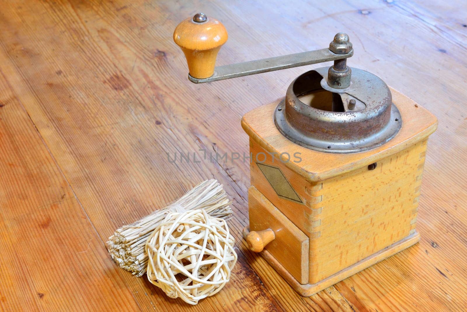 Old coffee grinder on an old wooden table