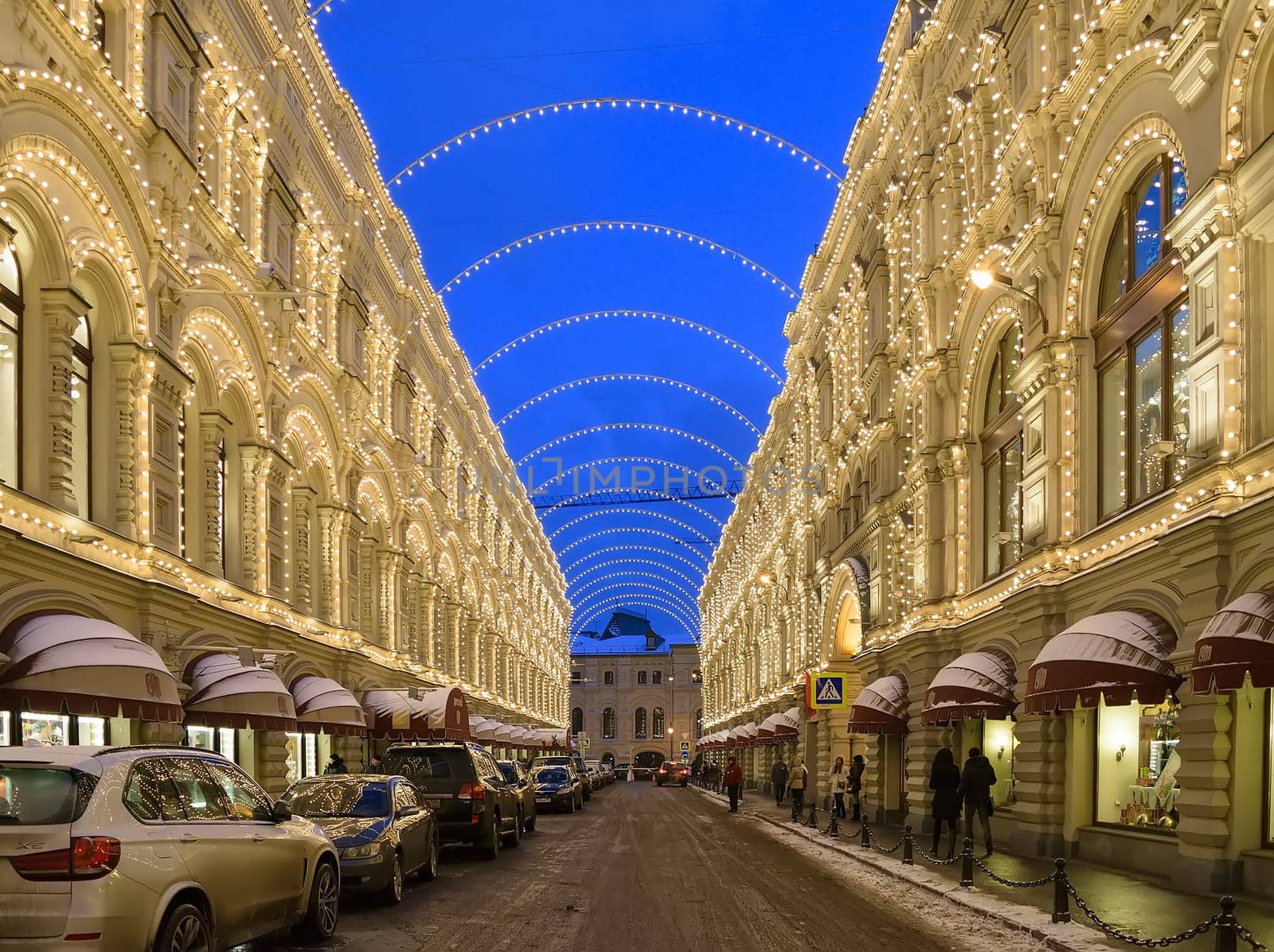 Moscow, Russia - January 05, 2016: Night Christmas illuminations on buildings in Vetoshny lane. GUM building on the right