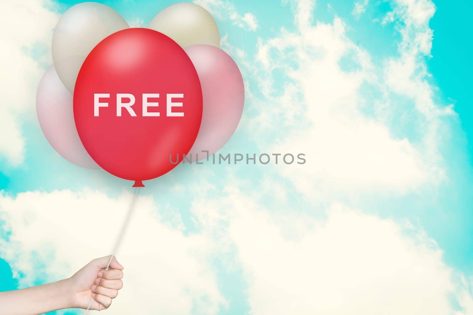 Hand Holding free Balloon with sky and vintage style