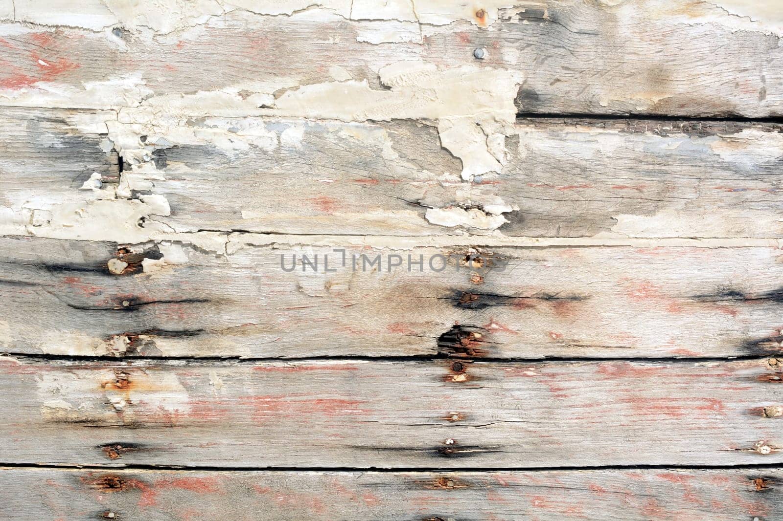 Wooden wall with paint residues