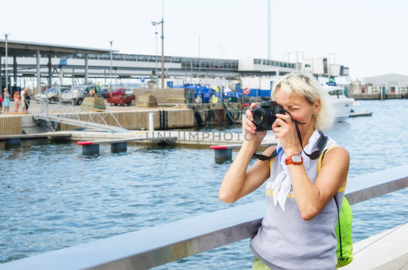 Woman photographs on the quay