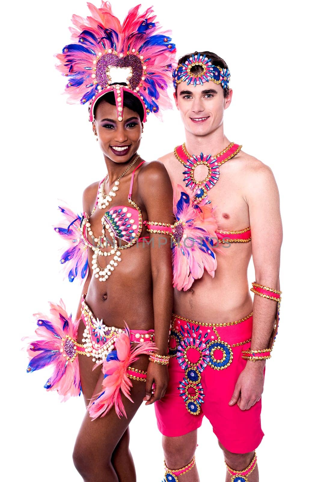 Happy samba dancers posing together in carnival costume
