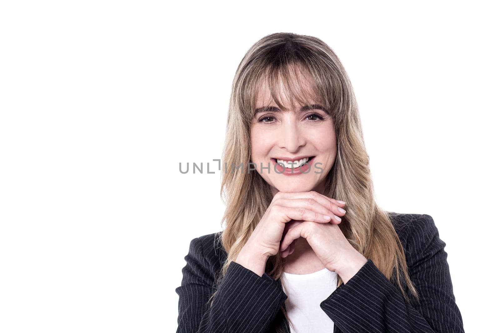 Smiling secretary posing to camera against white