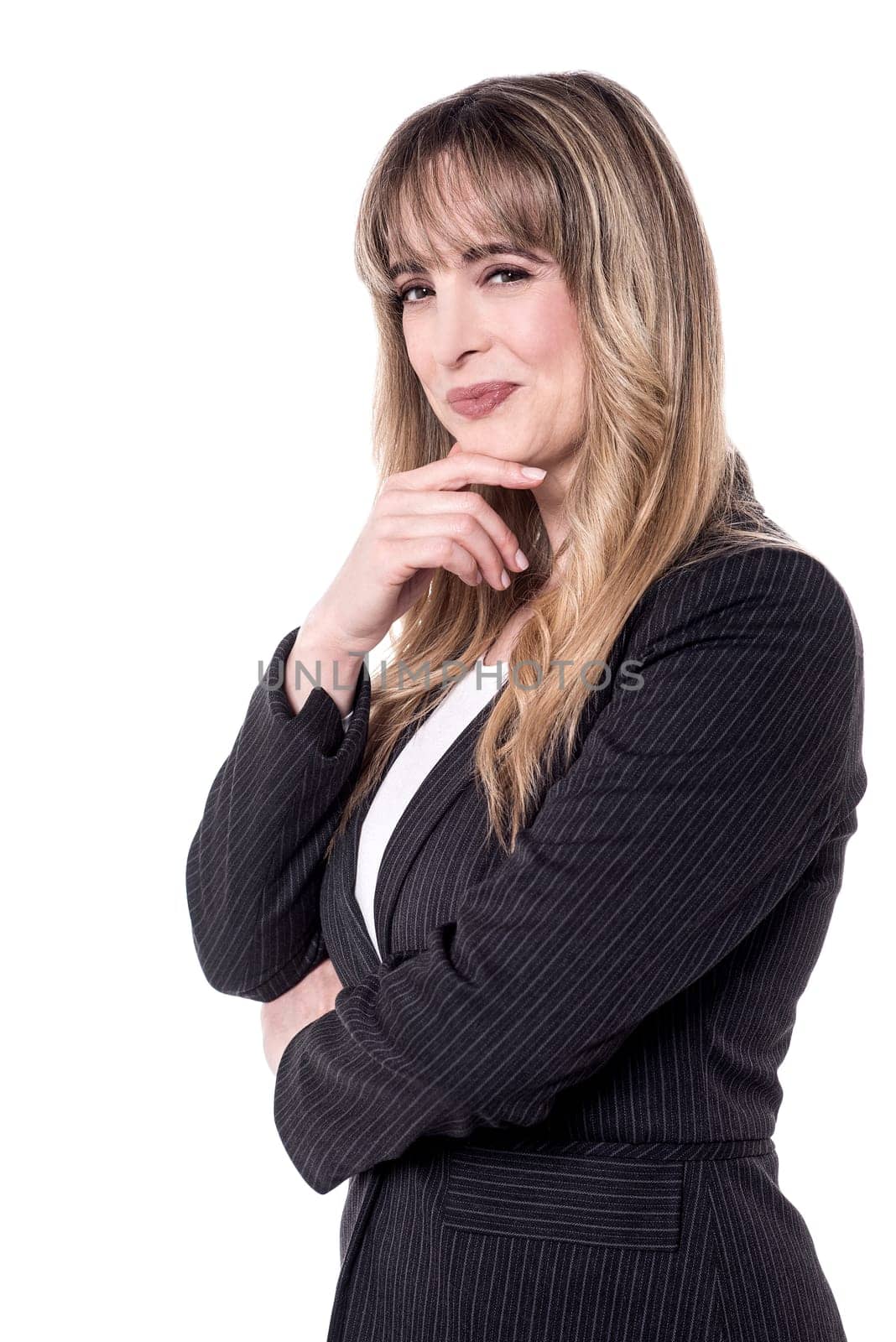 Business woman posing to camera with hand on chin