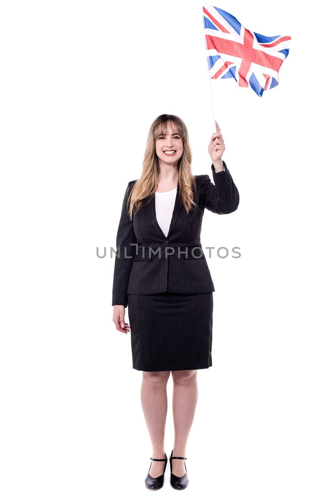 Full length image of businesswoman holding british flag
