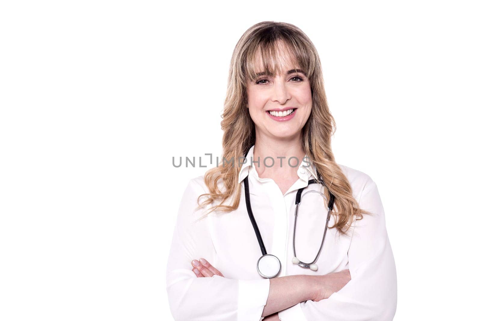 Confident female doctor with crossed arms over white.