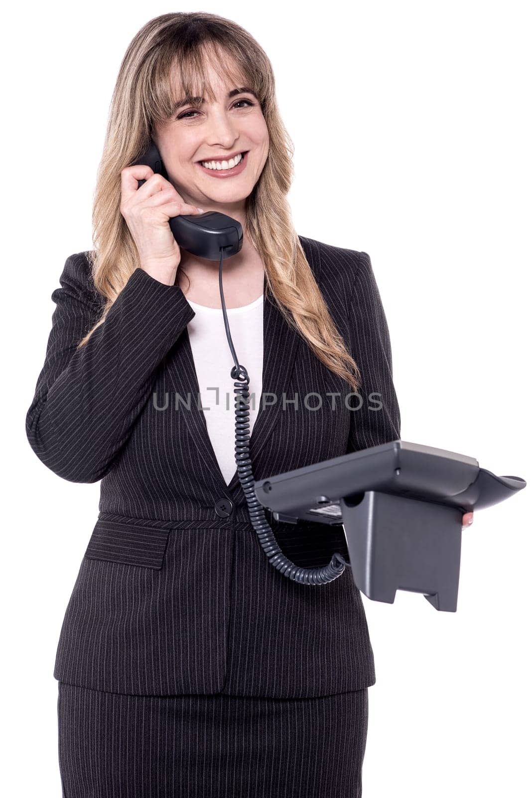 Smiling middle aged business woman on phone