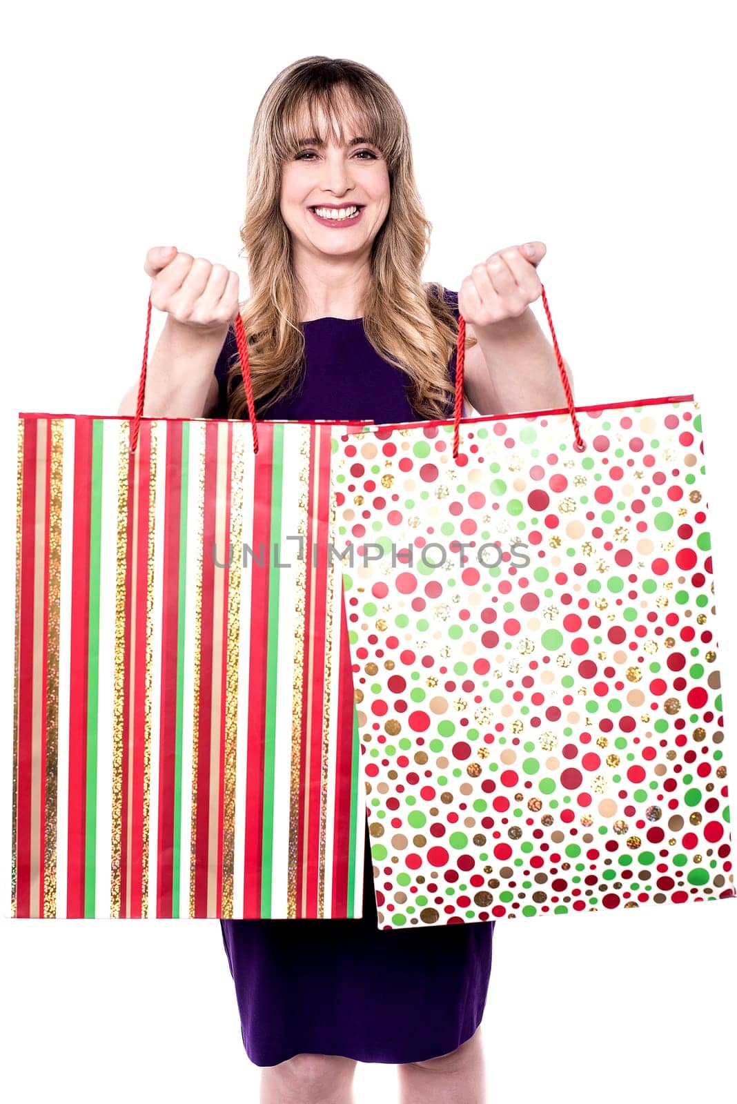 Picture of happy smiling woman holding shopping bag