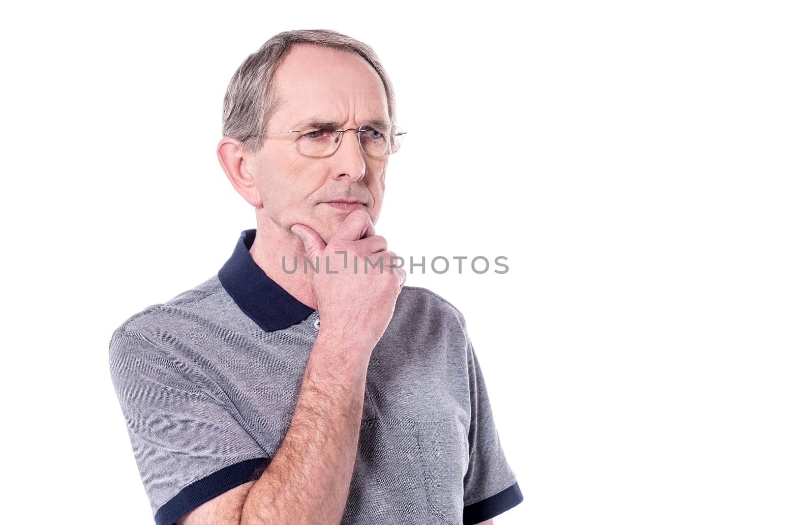 Senior man thinking about something over white.