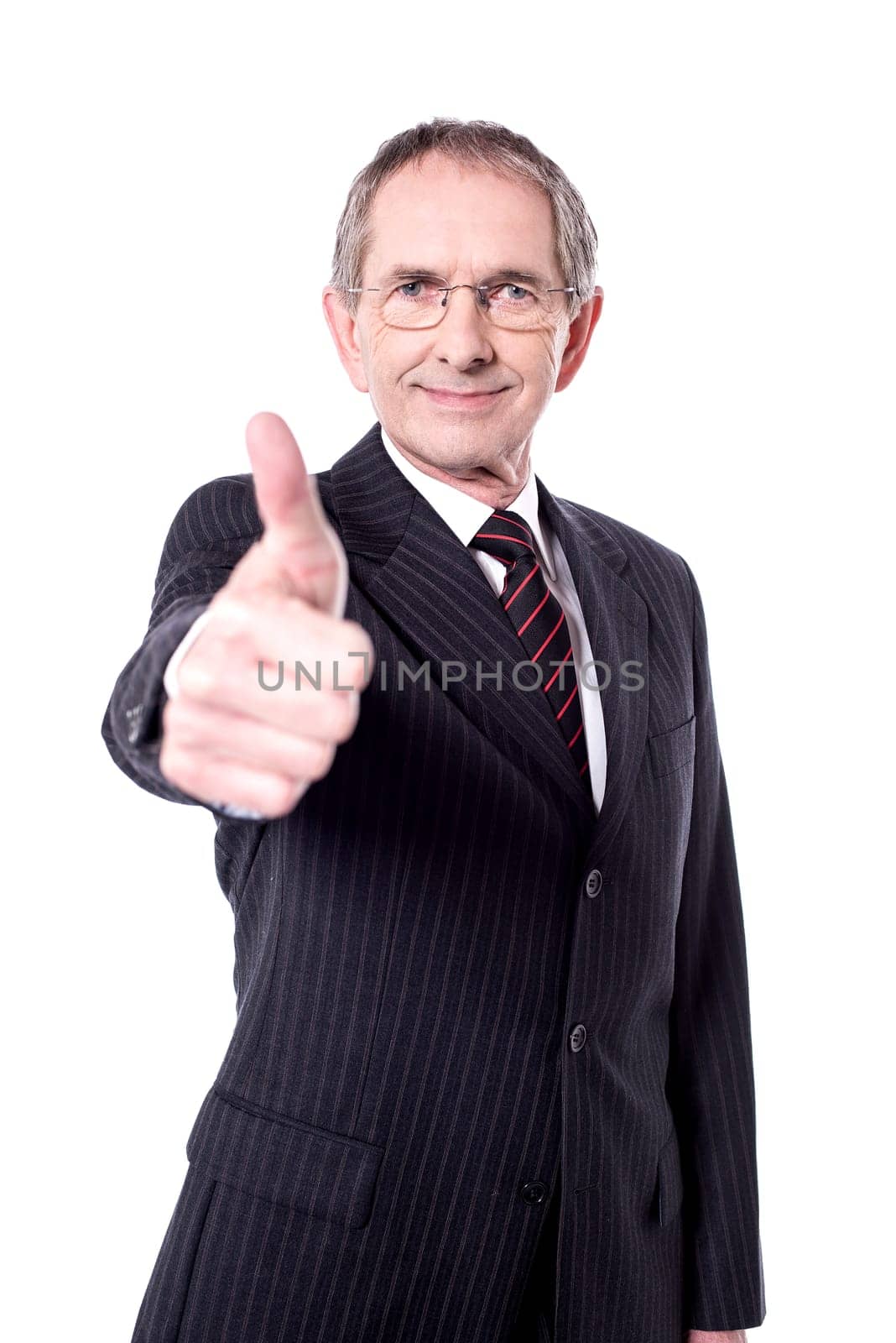 Handsome senior manager gesturing thumbs up over white