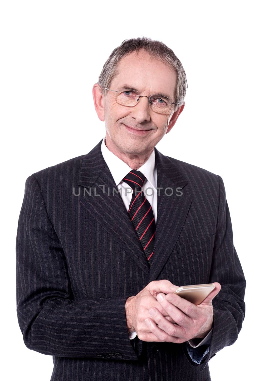 Confident aged businessperson messaging from his cellphone