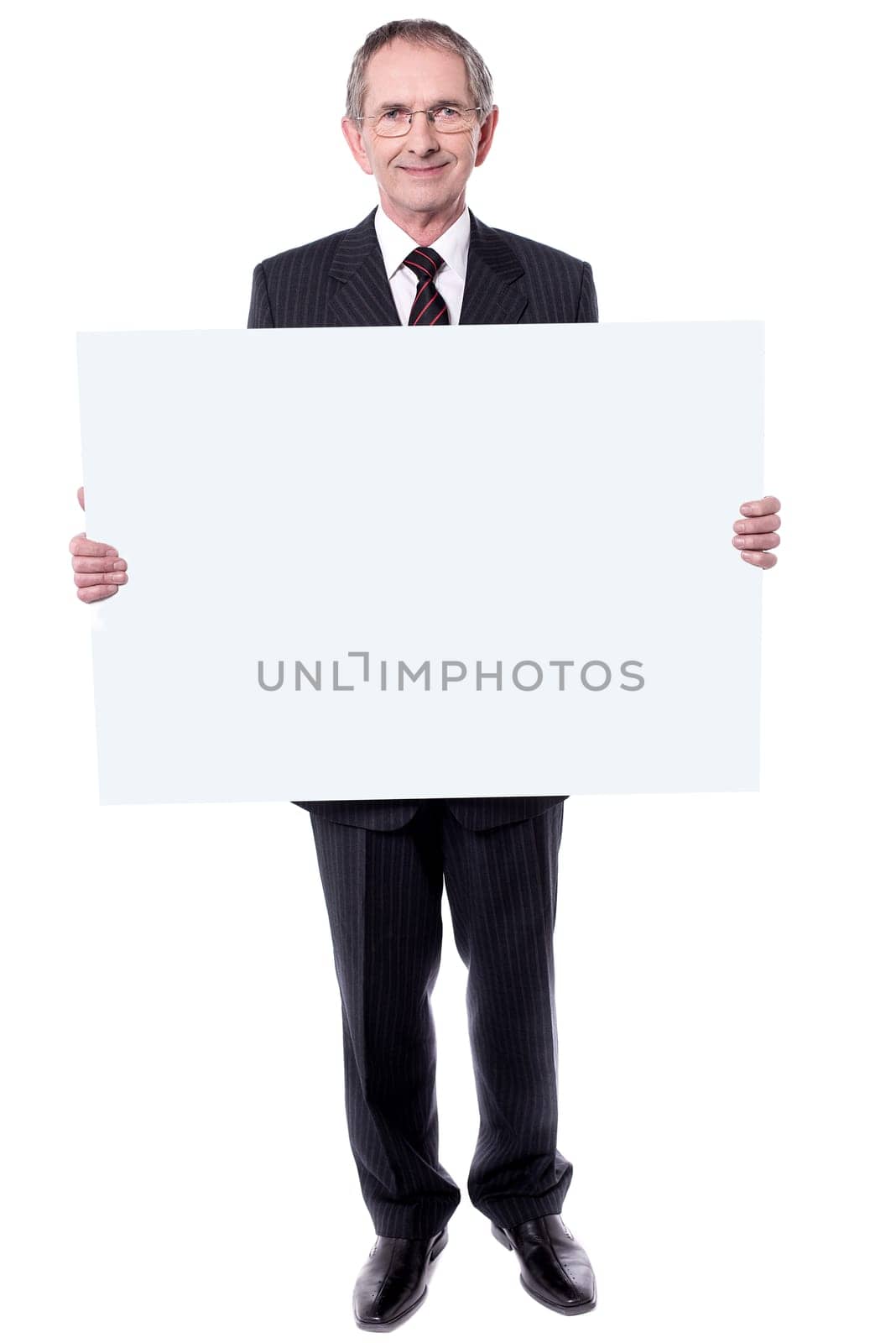 Handsome man holding blank white billboard. Showing to camera