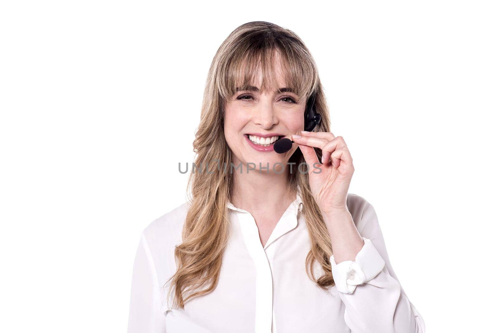 Customer support executive adjusting her head phone.