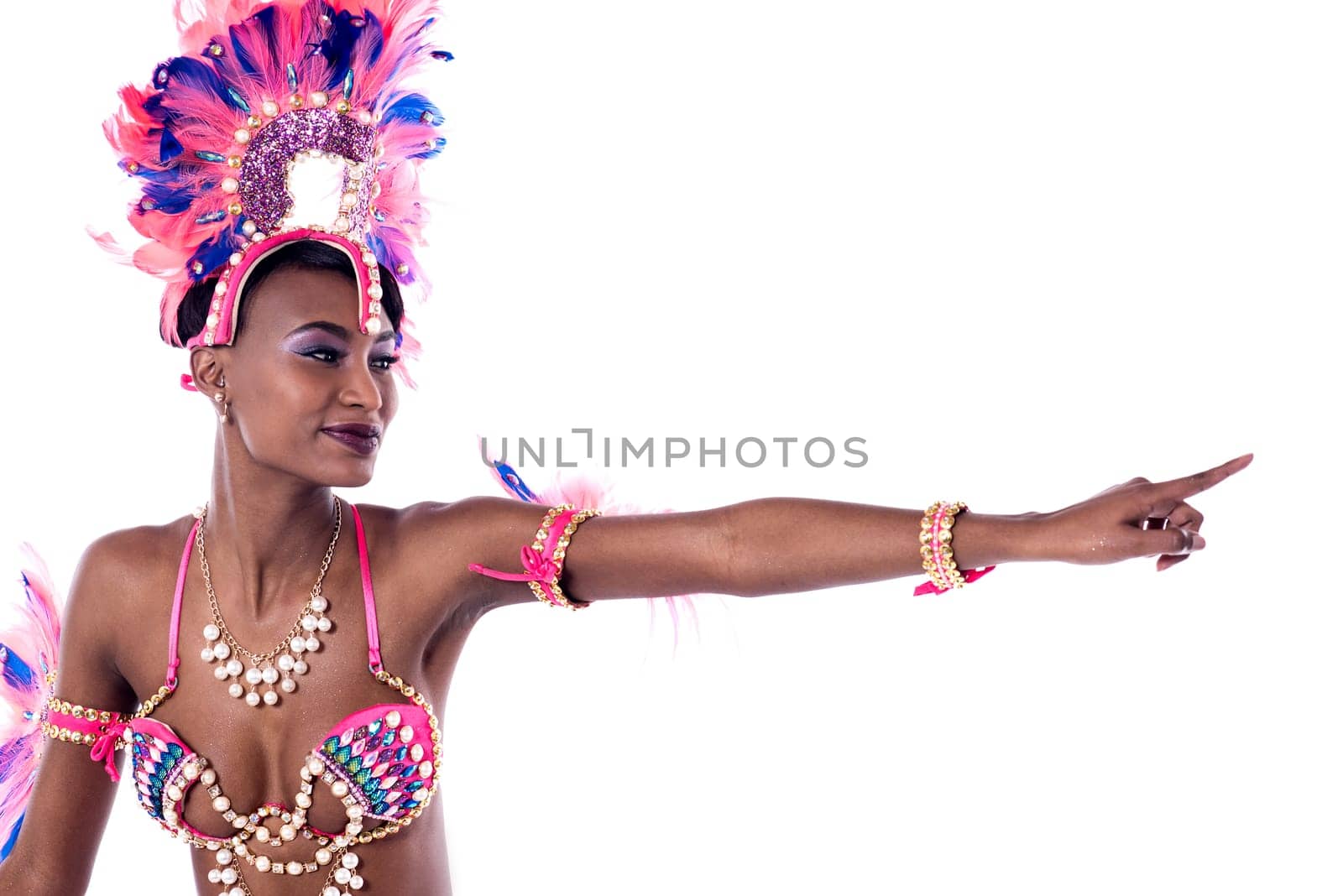 Cheerful african dancer pointing index finger to copy space