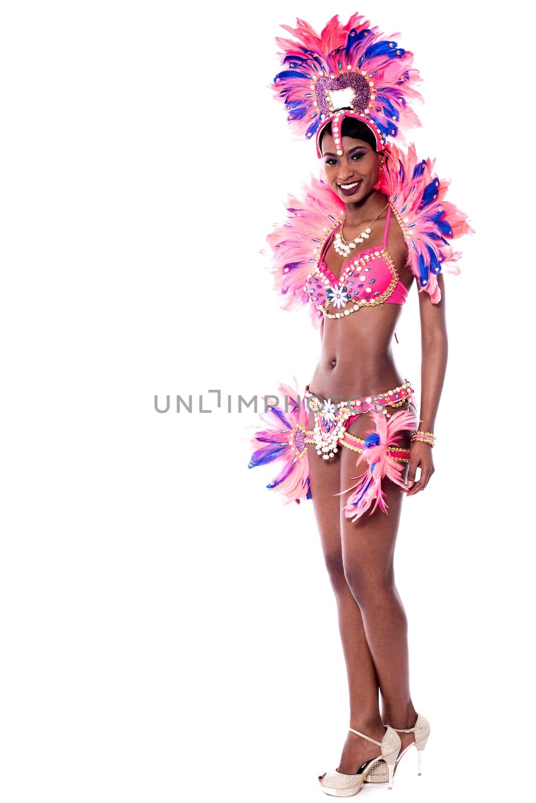 Young elegant dancer posing to camera over white