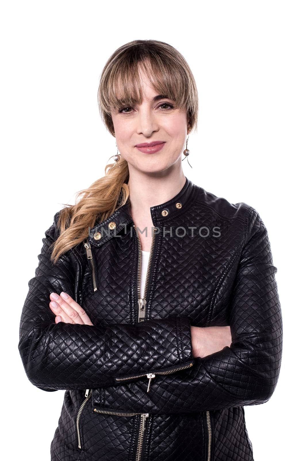 Beautiful woman posing to camera with folded arms