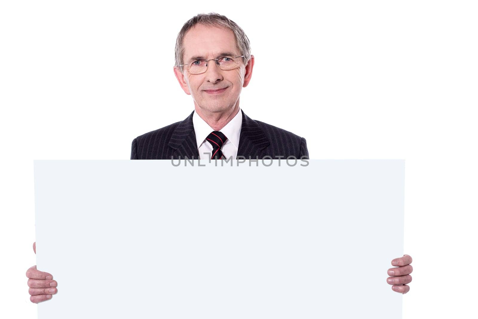 Portrait of Senior business man displaying blank ad