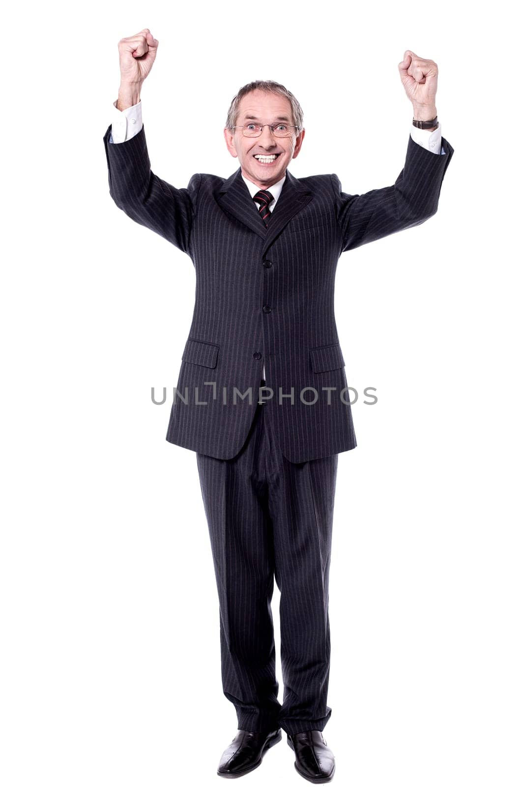Corporate man standing with arms up against white background