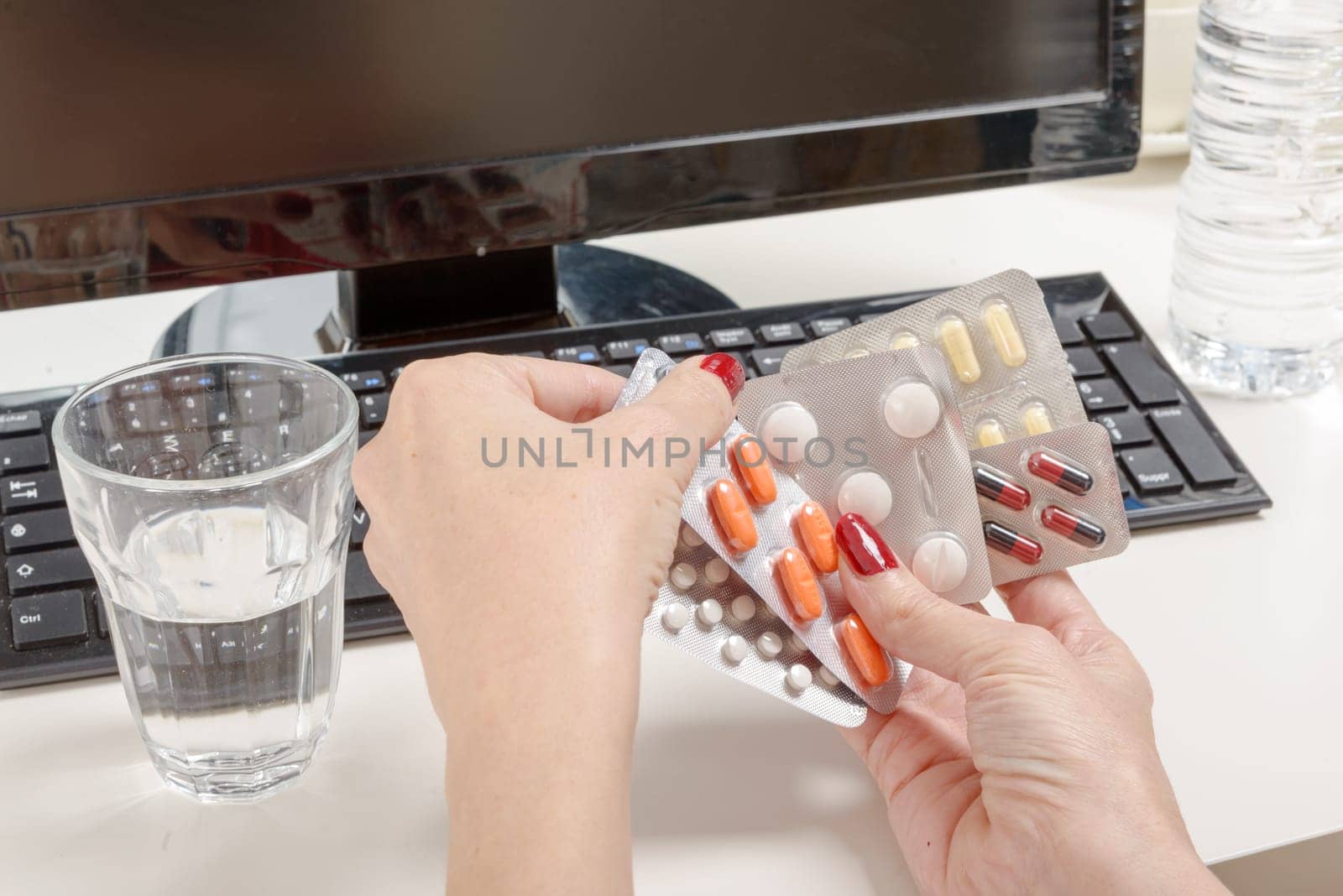 the pills with a computer, work pressure concept.