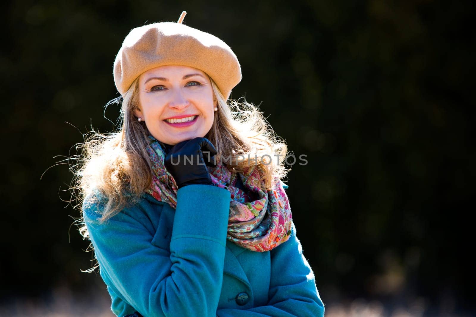 blond casual woman happy outdoors in the park