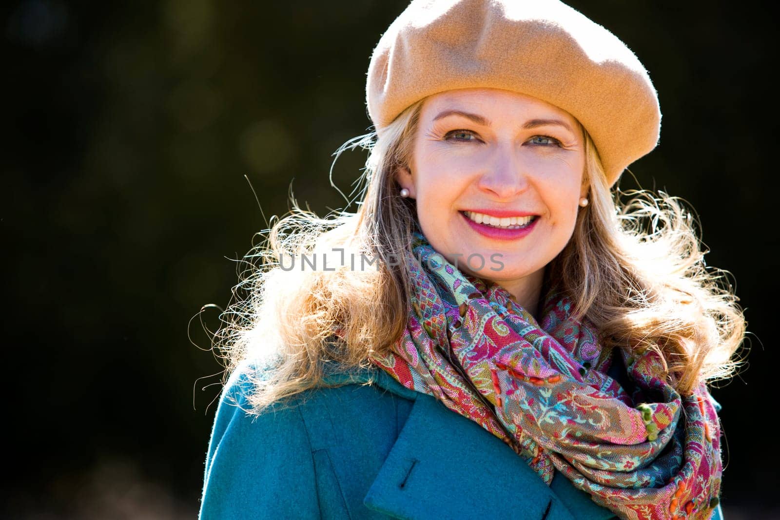 blond casual woman happy outdoors in the park