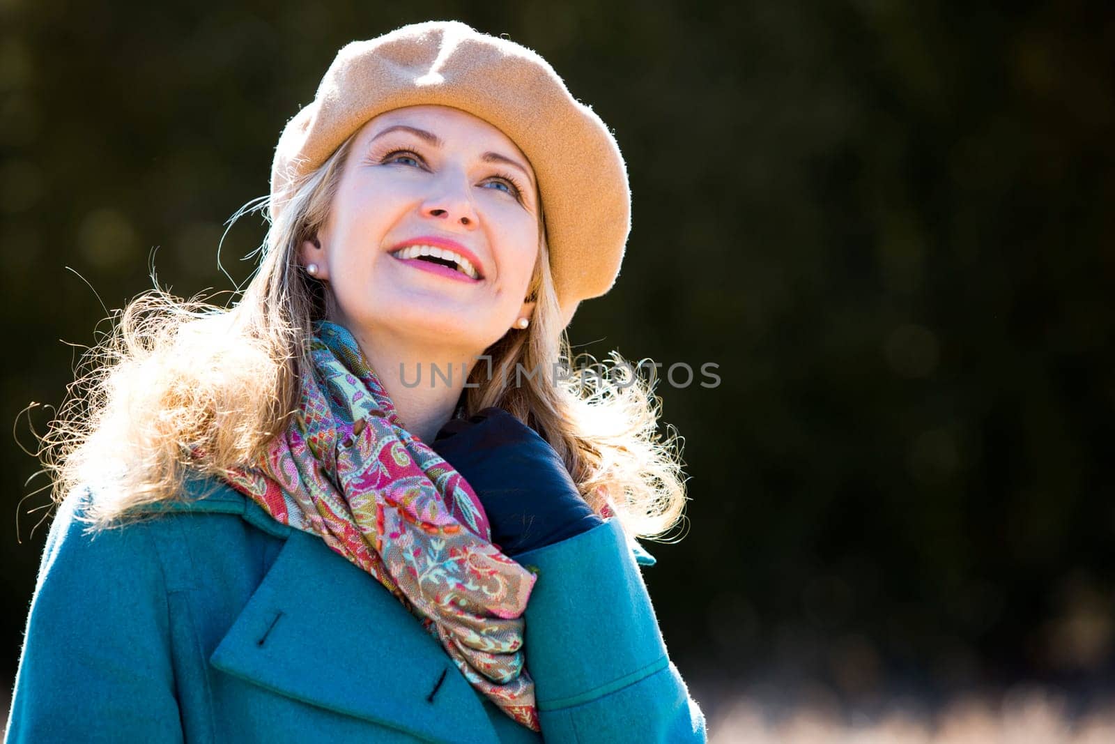 blond casual woman happy outdoors in the park