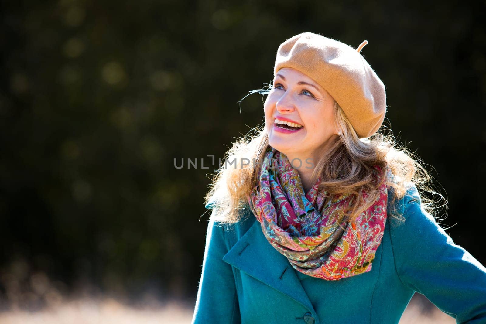 blond casual woman happy outdoors in the park