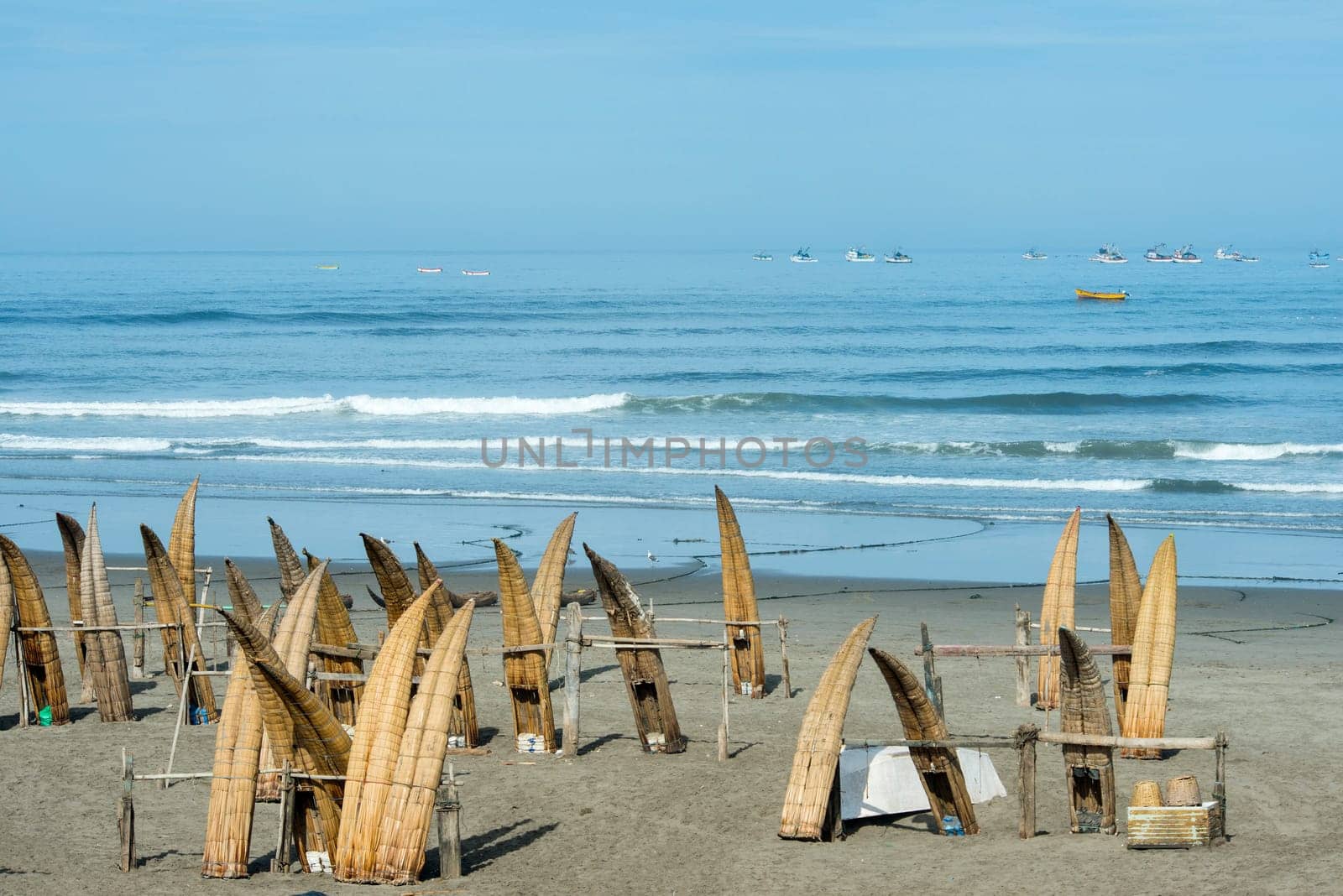 Traditional Peruvian small Reed Boats (Caballitos de Totora), straw boats still used by local fishermens in Peru