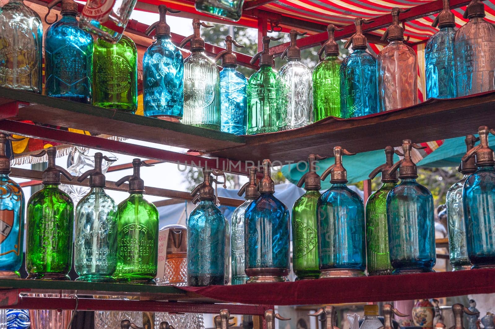 BUENOS AIRES - JUNE 26, 2011. San Telmo flee market, one of the most famous tourist place in Buenos Aires. Vintage bottles for sale on June 26, 2011 in Buenos Aires