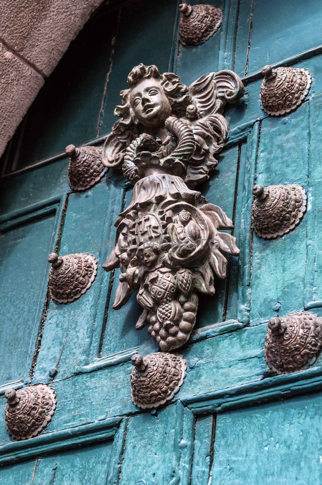Copper door decoration on the old door of the temple in Cuzco, Peru.