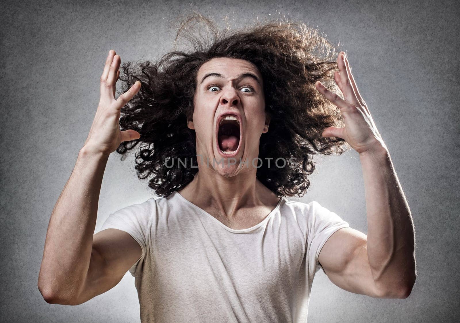 Young guy facing a mental collapse with a desperate expression
