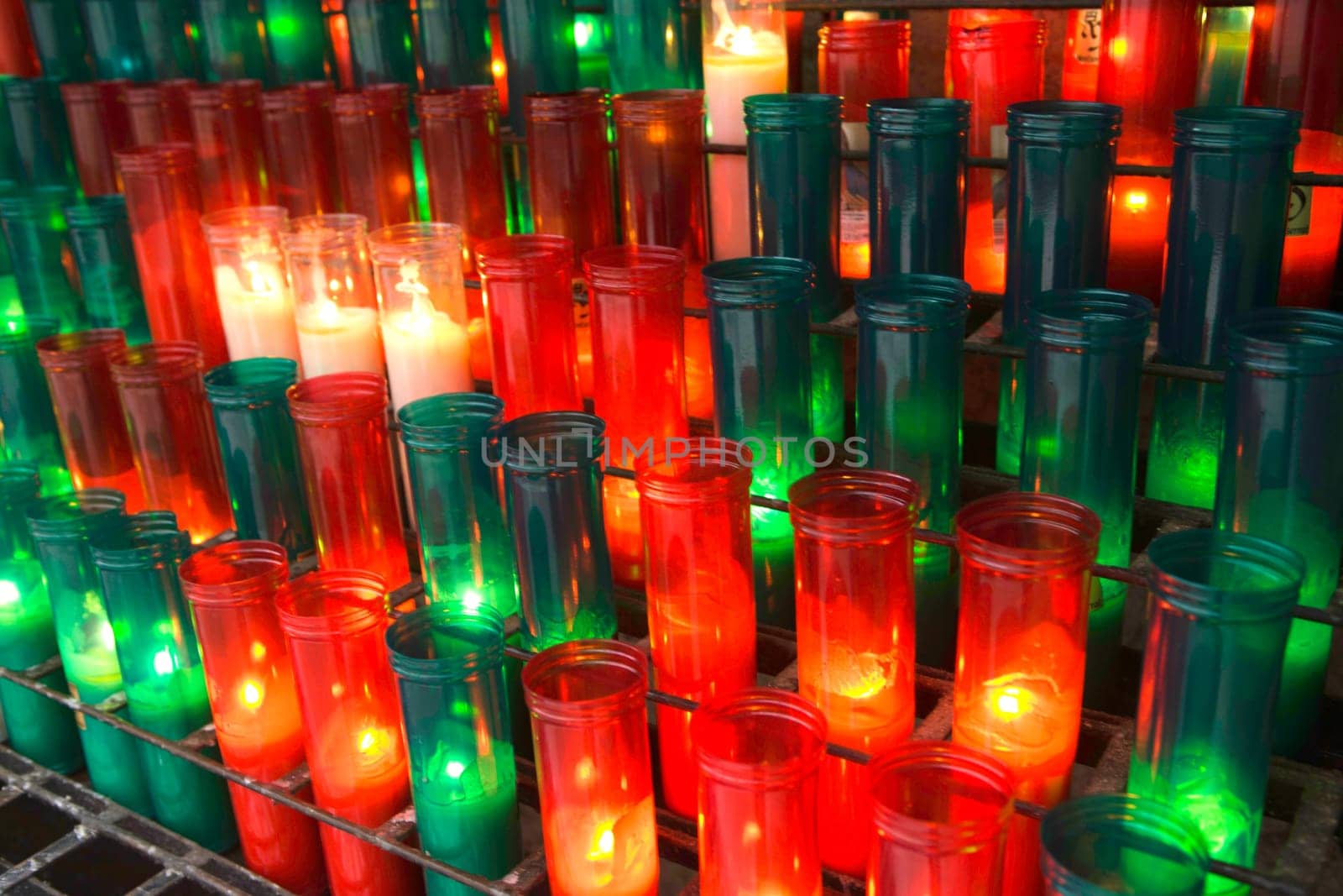 Red and green candles in the Monserrat Abby, Catalonia, Spain