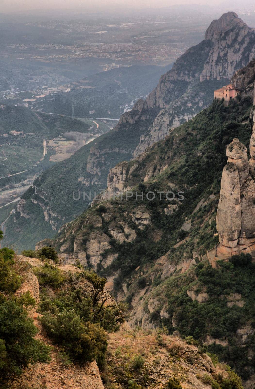 Montserrat mountain and the Cavall Bernat, the largest and best known of the Montserrat massif monoliths. Catalonia, Spain
