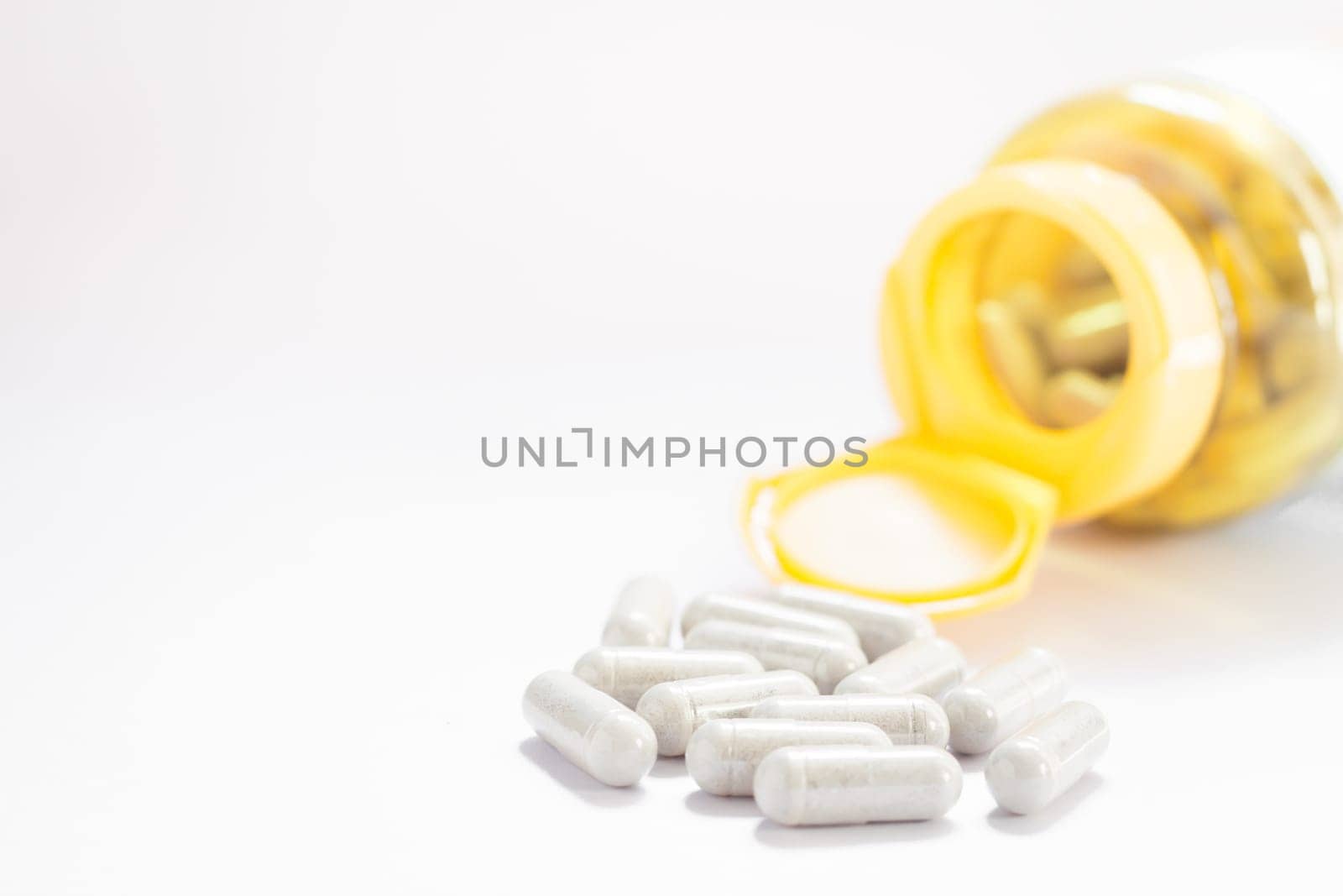 Close up capsules pill on white background, stock photo