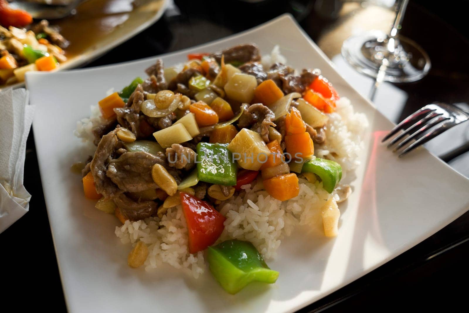Chinese food - stir fry beef with vegetables and nuts.