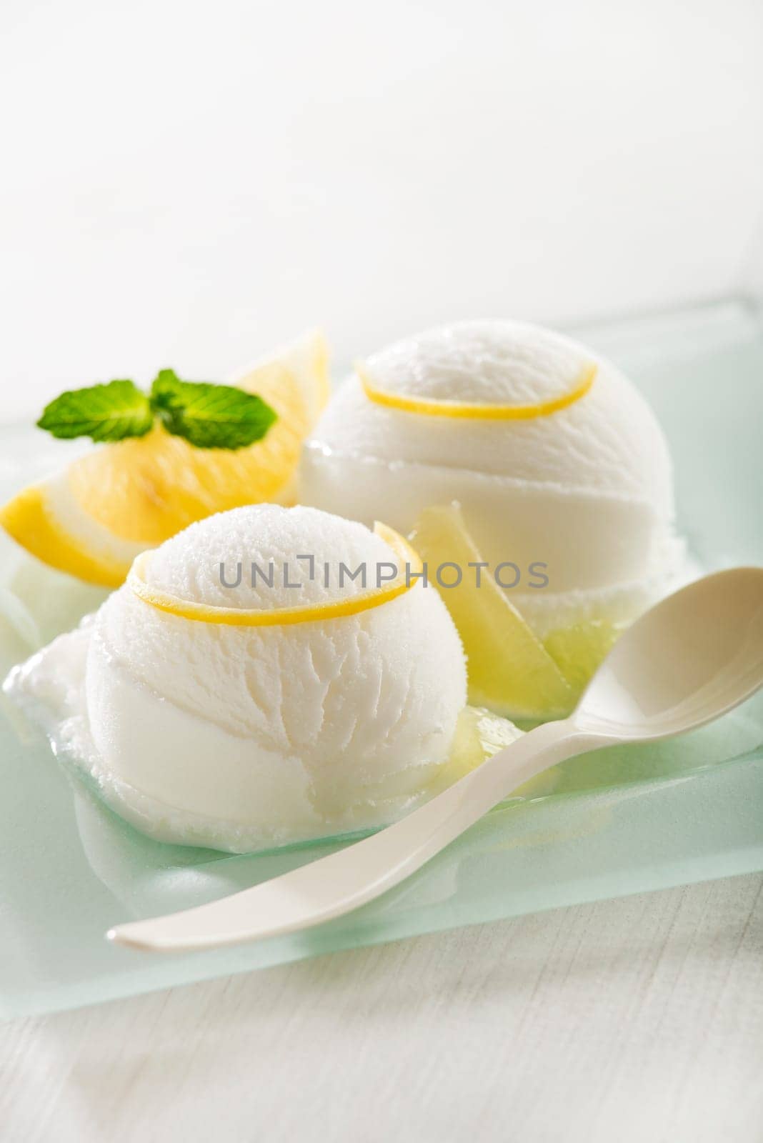 Fresh fruit sorbet ice cream in a white bowl.