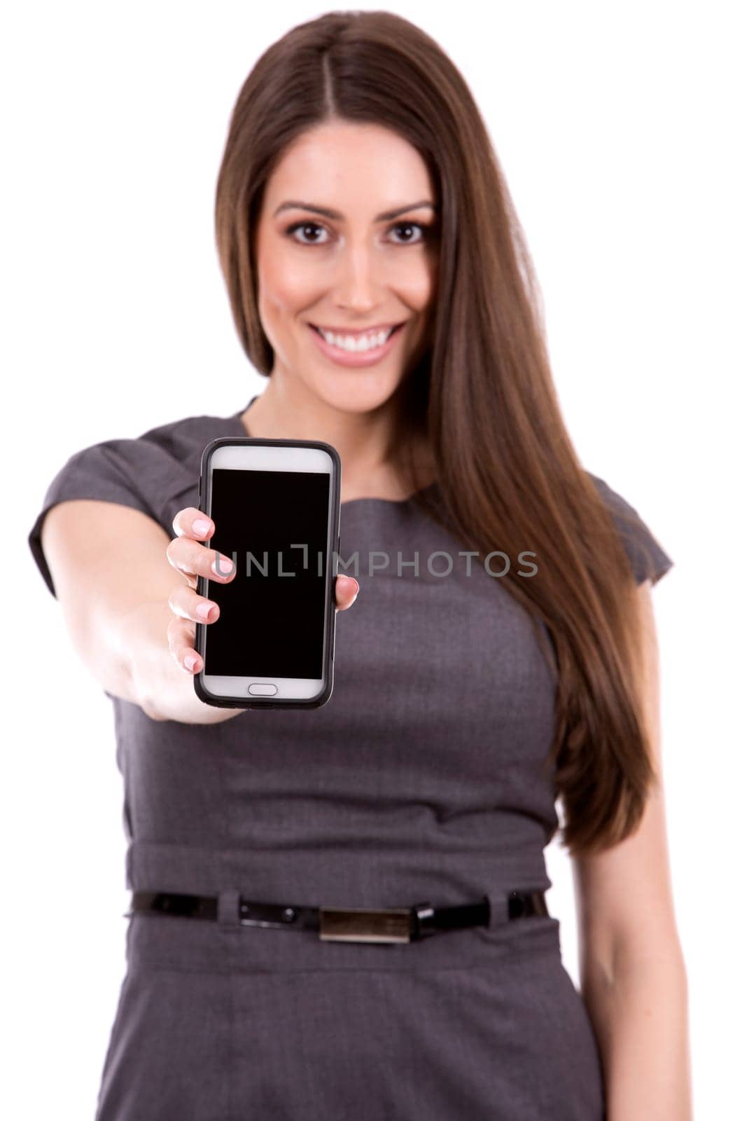 young caucasian woman using her cellphone on white background
