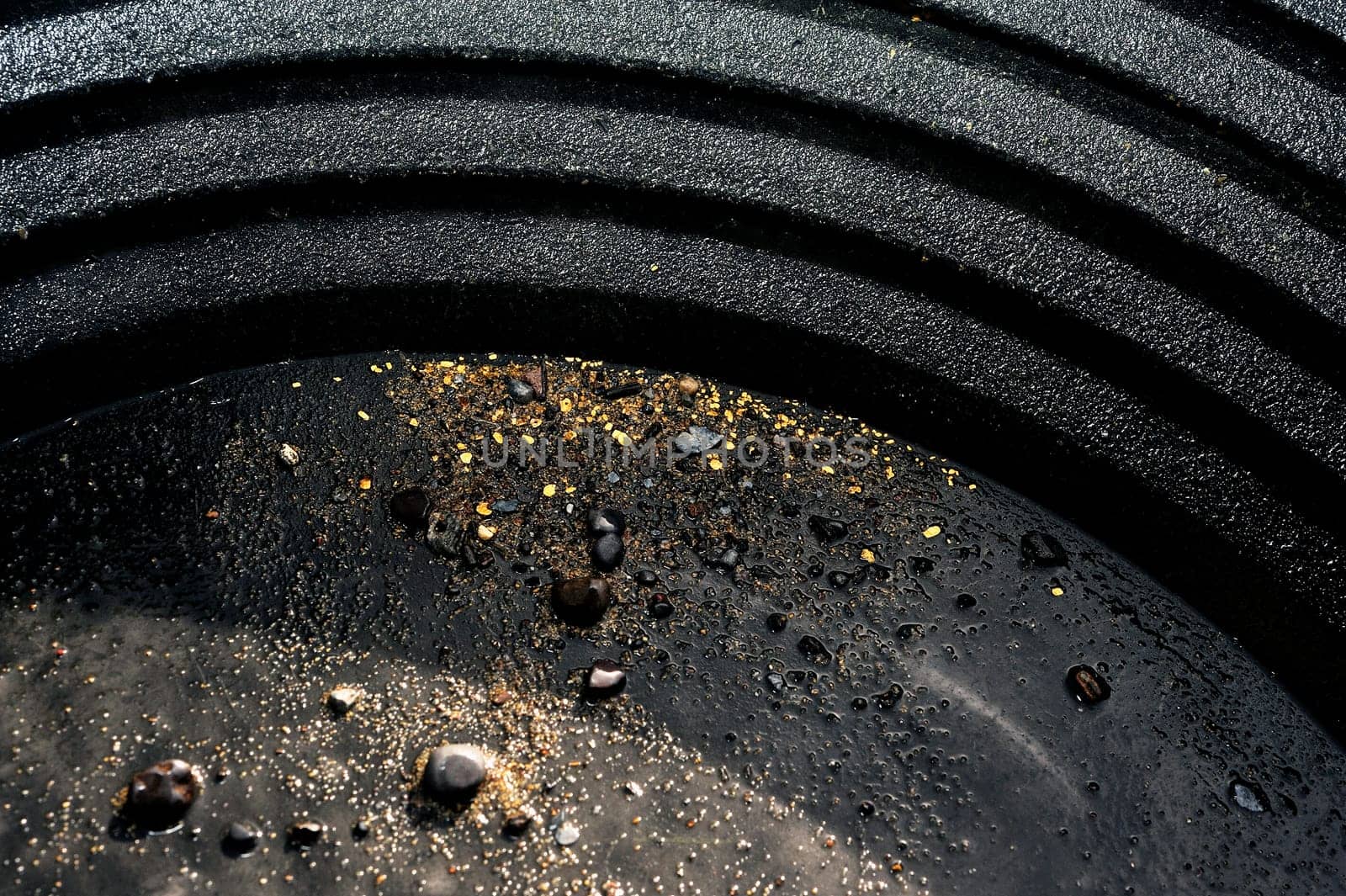 washing the gold in a pan