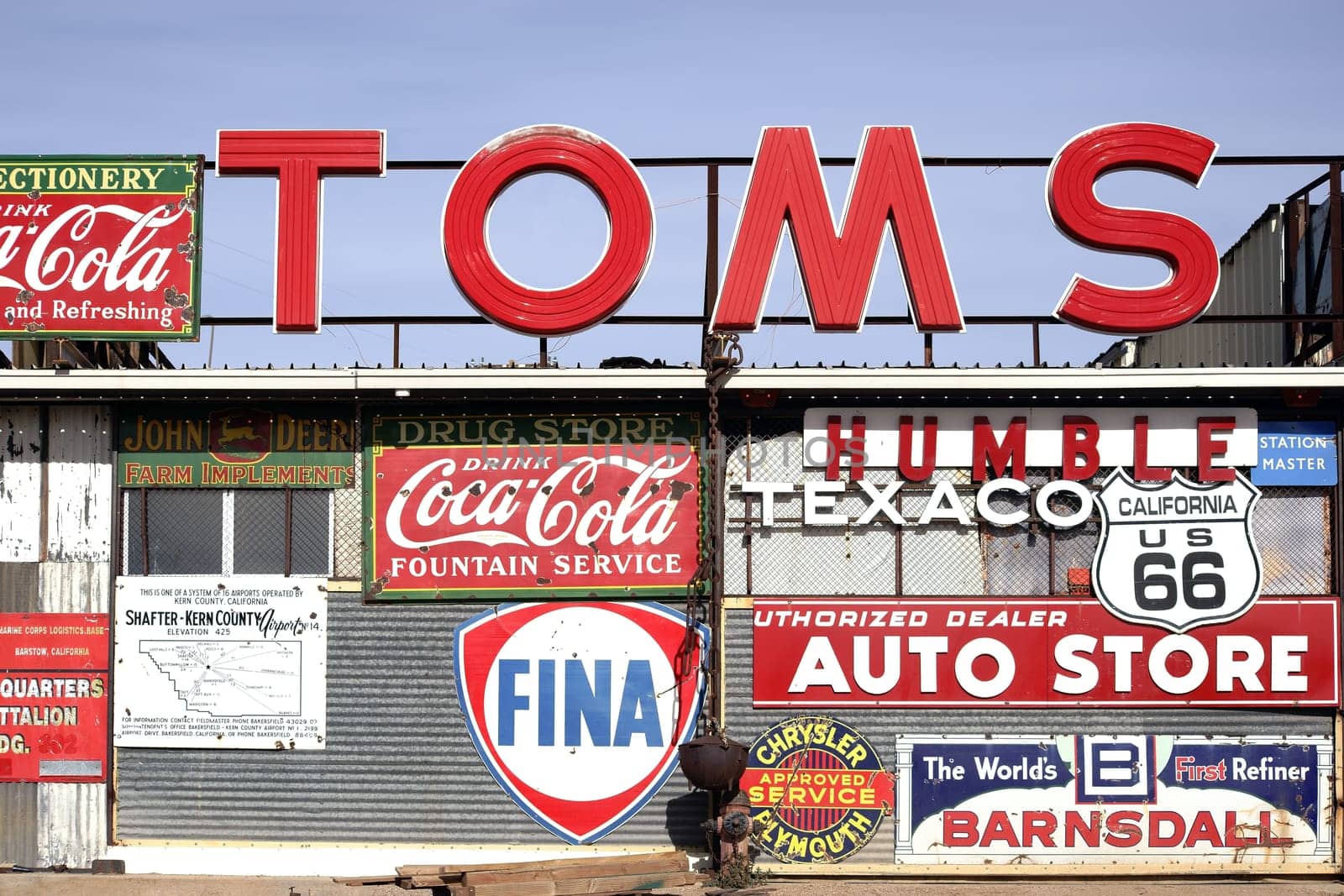 Barstow,United States - December 22,2015: A workshop with a large number of old vintage and retro signs of various brands on December 22,2015 in Barstow.