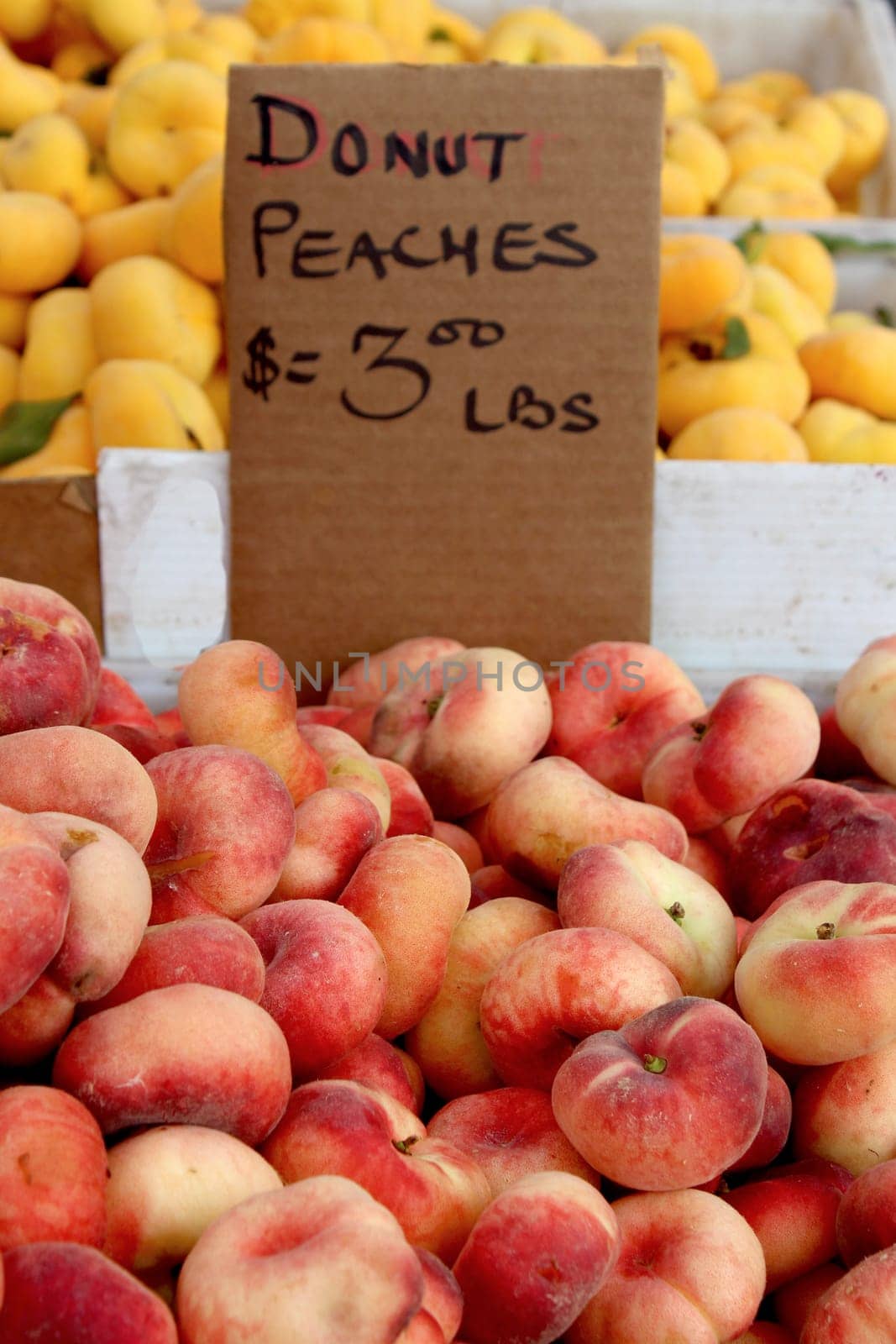 Fresh organic donut peaches background, photo taken at local farmers market, in New York City