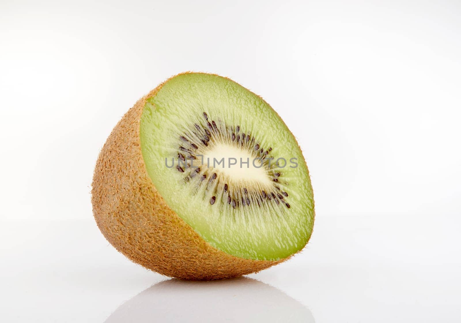 Kiwi cut in half on a white background
