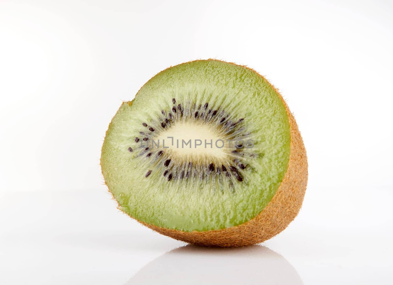 Kiwi cut in half on a white background