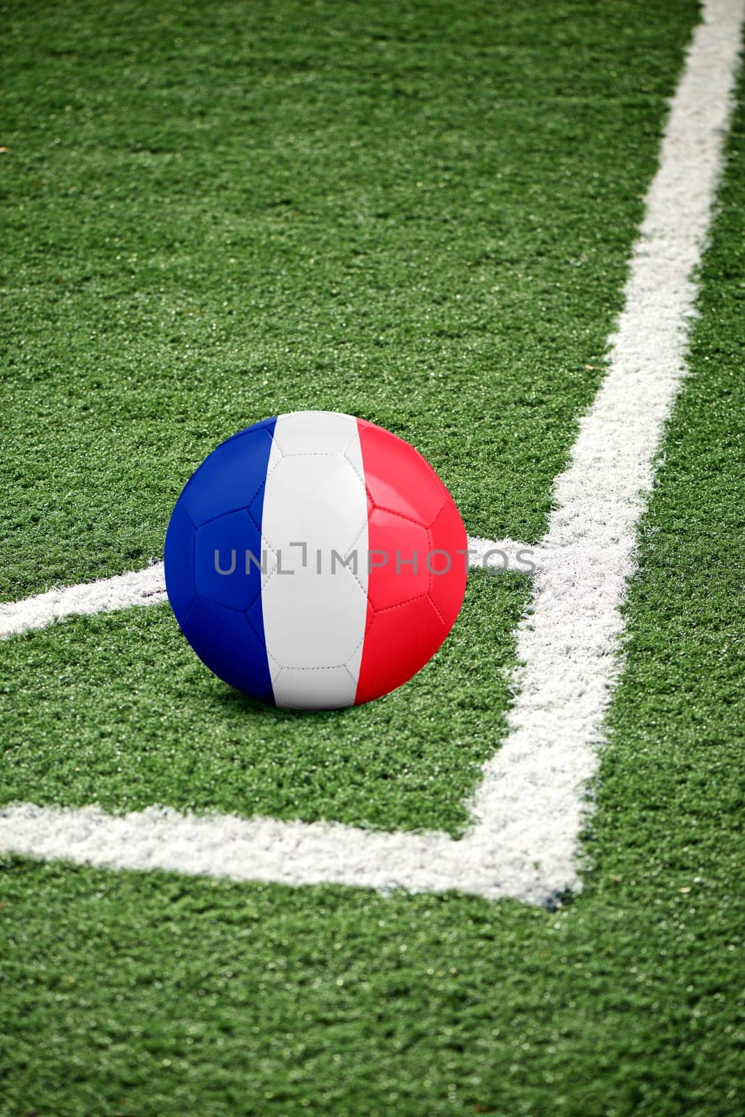 traditional soccer ball on corner from a green soccer field - flag France